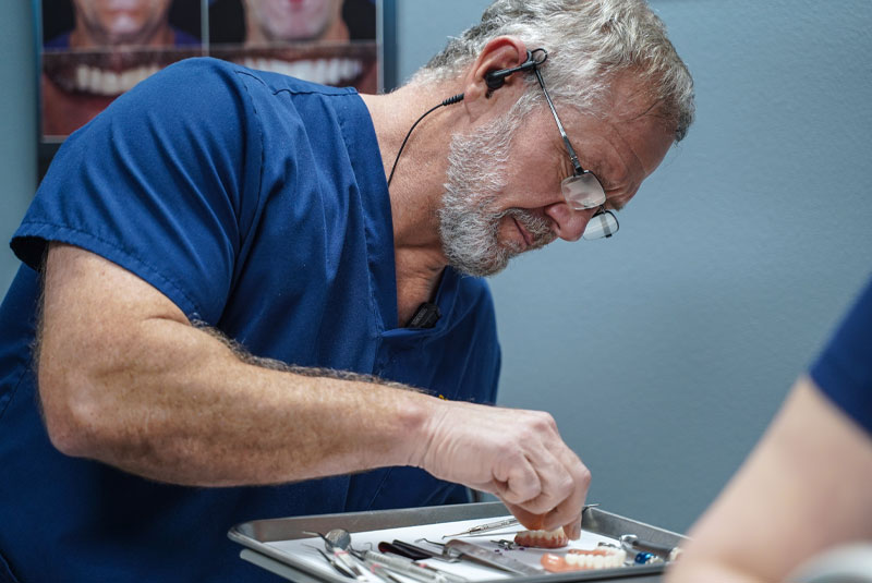 dr lynch performing dental impalnts procedure